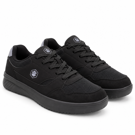 A pair of black low-top athletic sneakers with a textured mesh and suede upper, black laces, and a thick black sole, shown on a white background.