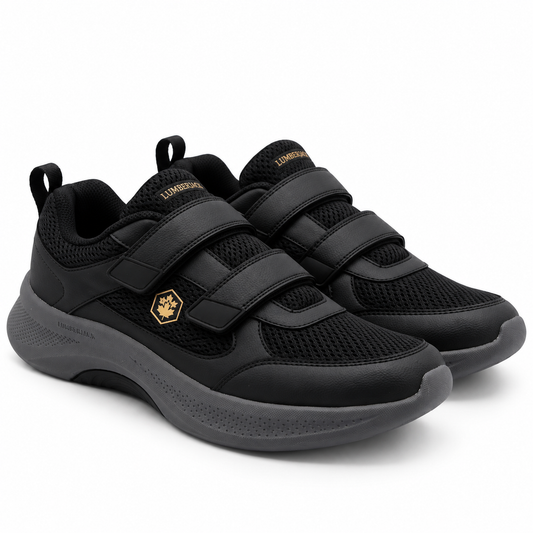 A pair of black Lumberslow athletic sneakers with hook-and-loop strap closures and a small gold logo on the side, shown on a clean white background.