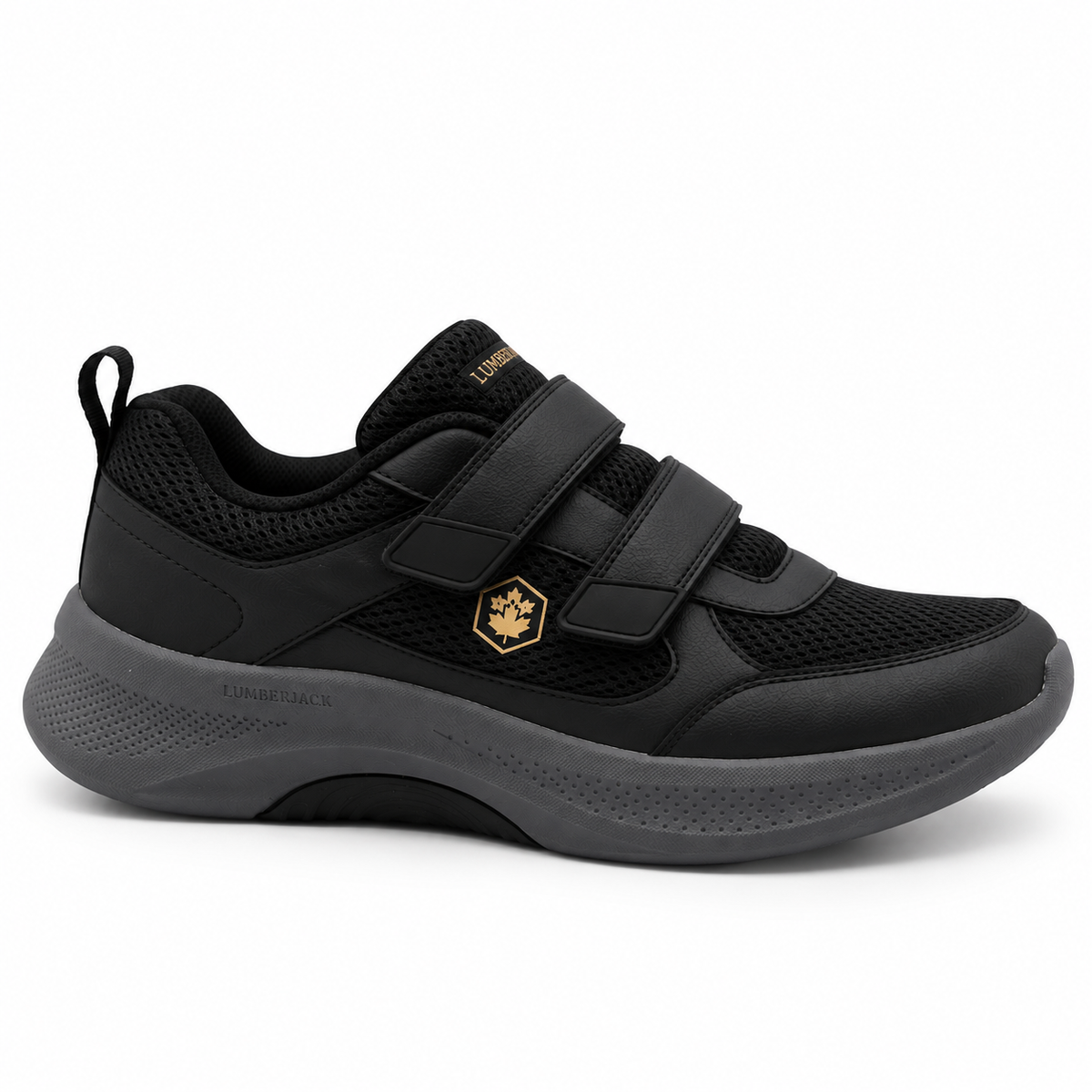 A black low-top athletic shoe with hook-and-loop strap closures, a gold hexagonal logo on the side, and a dark gray sole, shown against a plain white background.